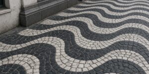 Wavy black and white cobblestone pavement in a traditional Portuguese pattern