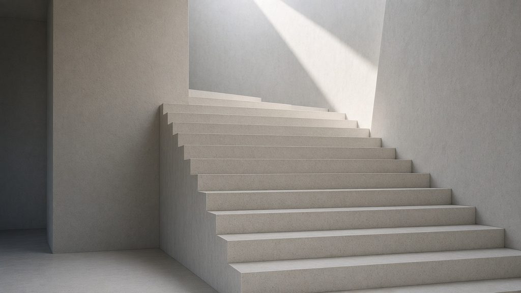 Concrete staircase lit by a beam of sunlight